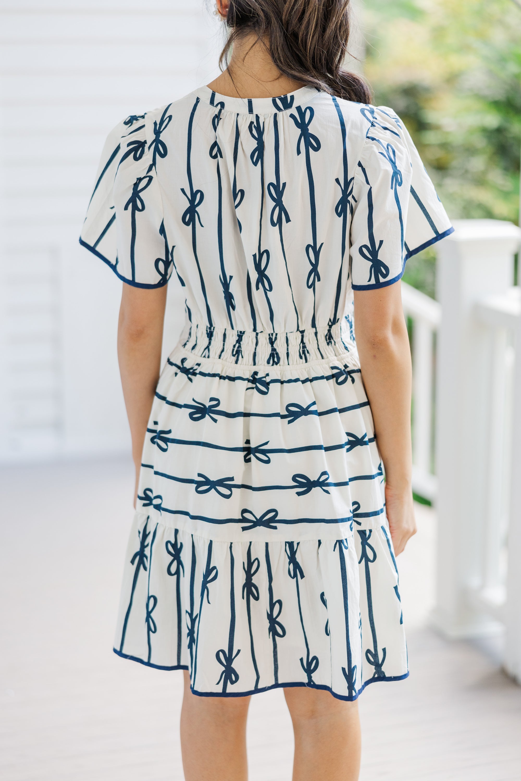 Charming Off-White Ribbon Printed Dress: A Must-Have!