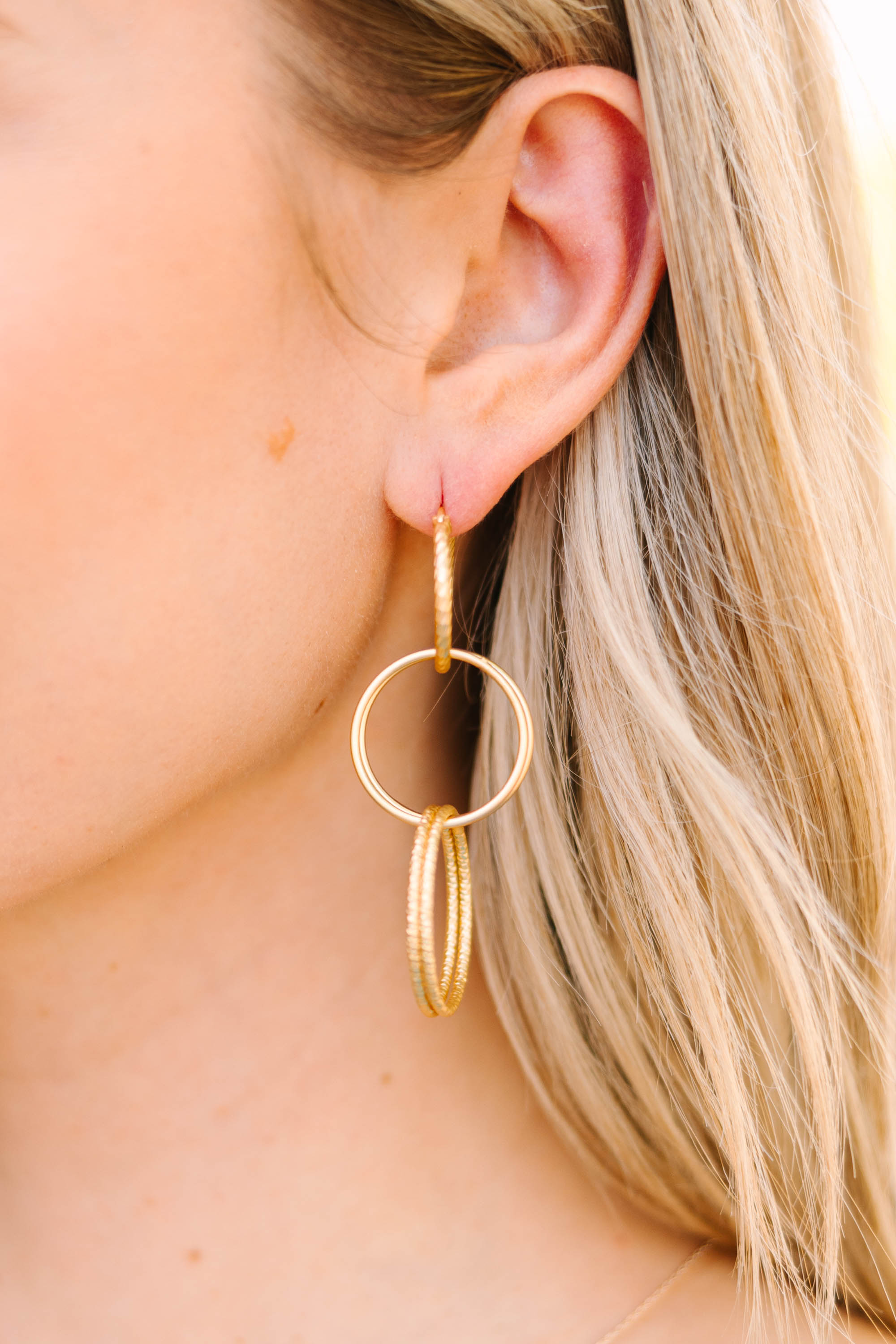 Glamorous Gold Interlocking Hoop Earrings - Express Your Style!