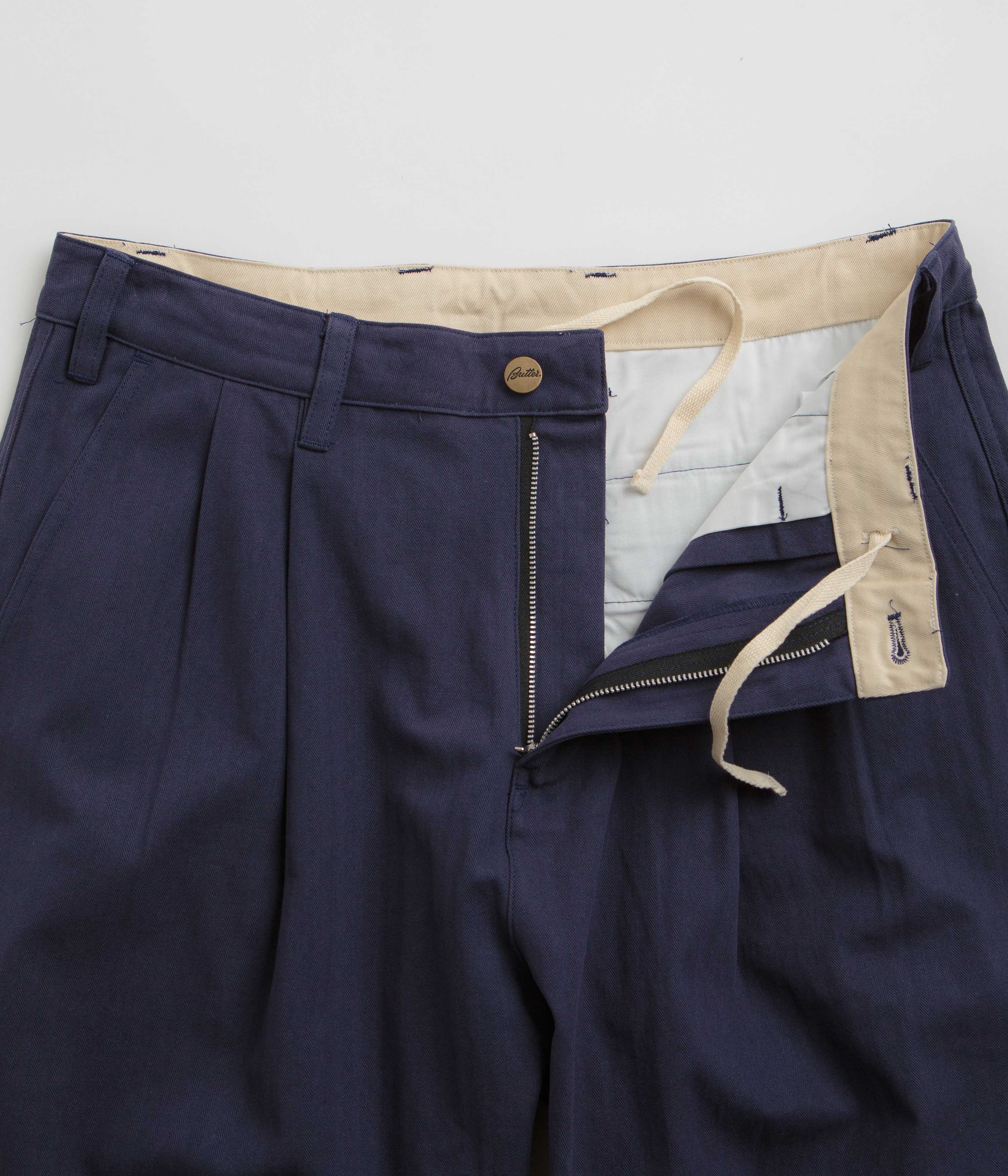 Navy Butter Goods Pleated Trousers - A Must - Have Fashion Item