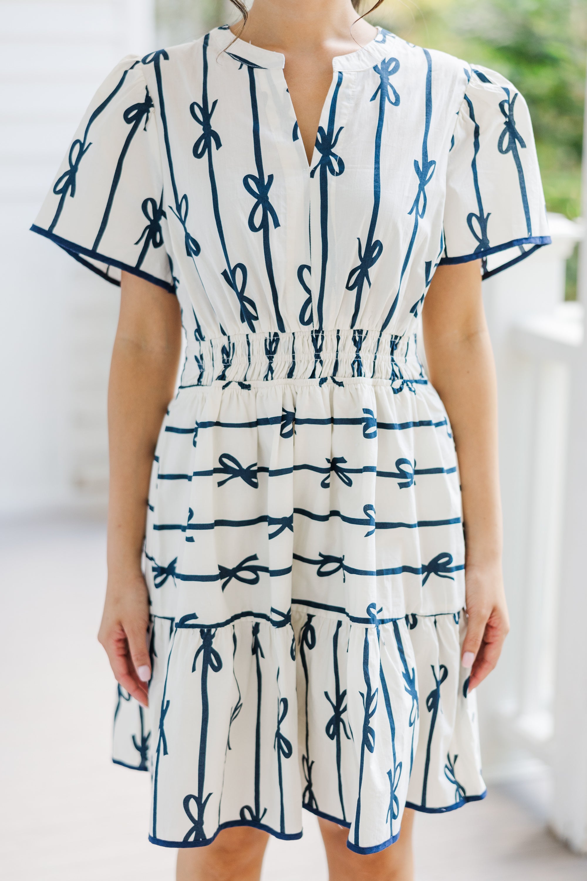 Charming Off-White Ribbon Printed Dress: A Must-Have!