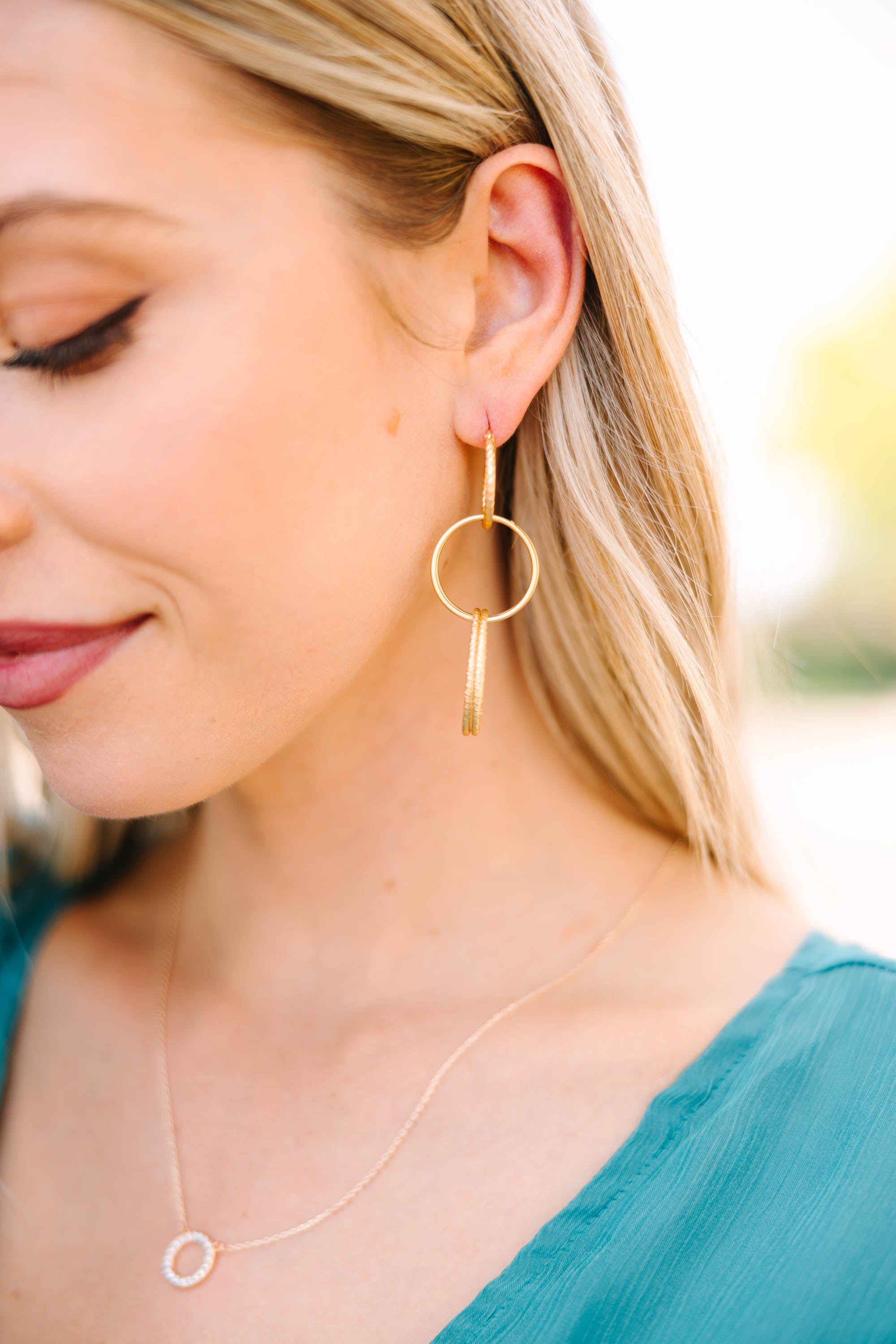 Glamorous Gold Interlocking Hoop Earrings - Express Your Style!