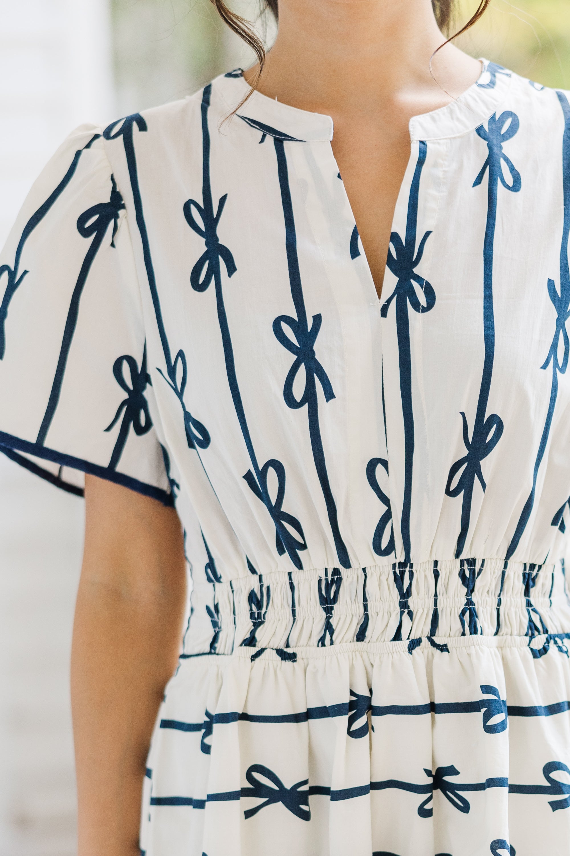 Charming Off-White Ribbon Printed Dress: A Must-Have!